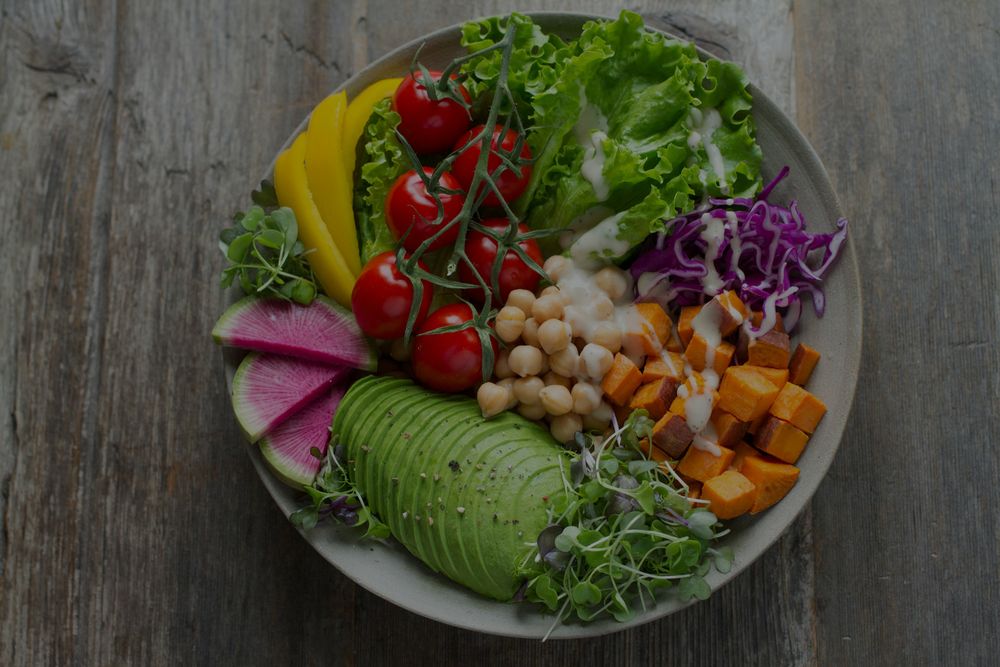 a shot over top of a plate of healthy fruit and vegetables