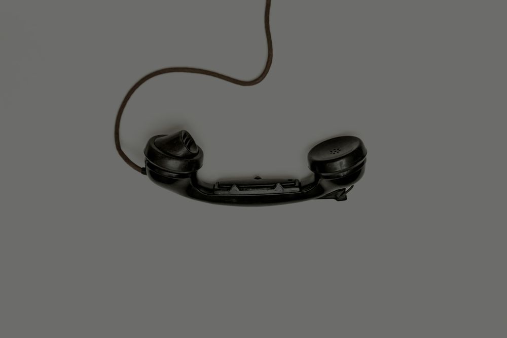 image overtop of a black old phone